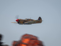 P-40 flying past exploding pyro